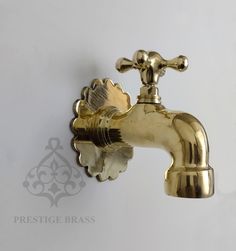 a gold faucet with the handle on it