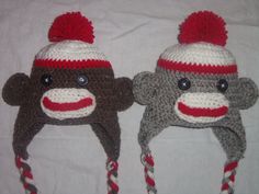 two crocheted hats with monkeys on them