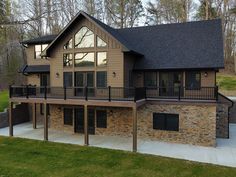 a large house with stone and wood sidings