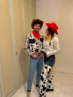 a man and woman dressed up as toy story characters