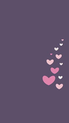 hearts are flying in the air on a purple background