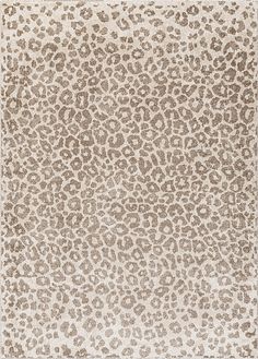 an animal print rug with brown spots on it