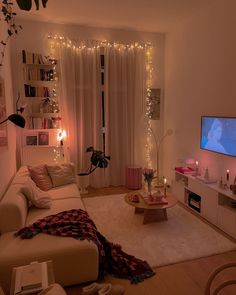 a living room filled with furniture and a flat screen tv