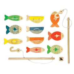 the wooden toy fish is next to a piece of wood and some string on a white background