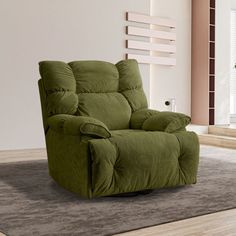 a green recliner sitting on top of a rug in front of a white wall