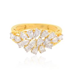 a yellow gold ring with white stones on the sides and leaves in the middle,