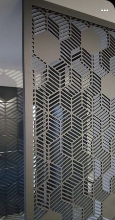 an intricate metal screen in the shape of hexagons