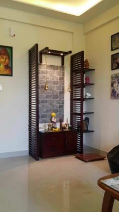 a living room filled with furniture and pictures on the wall