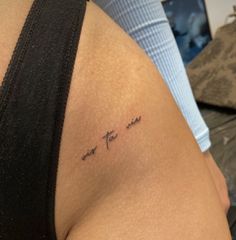 a woman with a tattoo on her arm that says, you are the one and is not