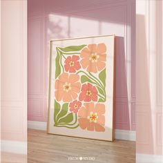 an orange and pink flowered painting on the wall in front of a wooden floor