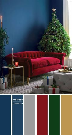 a living room with red couches and christmas tree in the corner, surrounded by blue walls