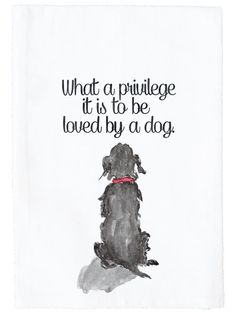 a black dog sitting on top of a white sheet with the words what a privilege it is to be loved by a dog