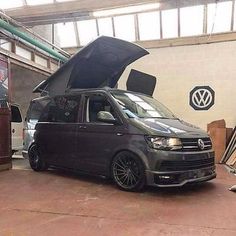 a van with its hood open parked in a garage