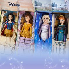 three disney princess dolls in their boxes with snowflakes on the wall behind them