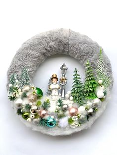 a christmas wreath with ornaments on it