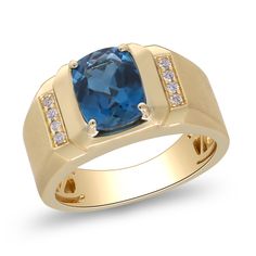 a gold ring with a blue stone and diamonds