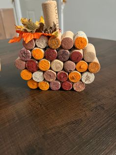 a stack of wine corks sitting on top of a wooden table