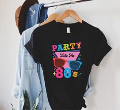 party like the 80's t - shirt hanging on a rack