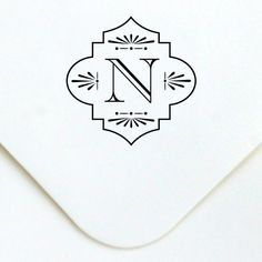 an envelope with a monogrammed letter n on it