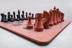 a set of chess pieces sitting on top of a board