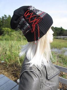 "Cool Hats Bohemian Looks Fair Isle Knit Hat Suede Leather Corset Black White Red Red Faux Leather Corset Tie Accent. Cotton Blend **CHOICE of LACING Color Gray RED Black Medium weight Knit warmer hat. with second knit layer in Fair Isle pattern Measurements: 12\" tall Measurement around Rib 18\" 25.5\" stretched (Medium) Thicker fabric Fair Isles do not stretch too much ) models head size is 22.5\" contents: 60% cotton 40% Acrylic Faux Suede Lace Vacationhouse Hats Many styles and looks. ------ Bohemian Fitted Hat For Winter, Bohemian Fitted Winter Hat, Fitted Bohemian Winter Hats, Bohemian Hats For Cold Weather, Bohemian Hats For Cold Weather And Fall, Bohemian Hats For Cold Winter Weather, Bohemian Winter Hats For Cold Weather, Bohemian Hats For Winter, Bohemian Black Winter Hat