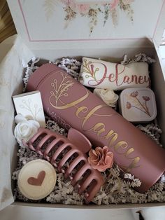 an open gift box filled with decorative items