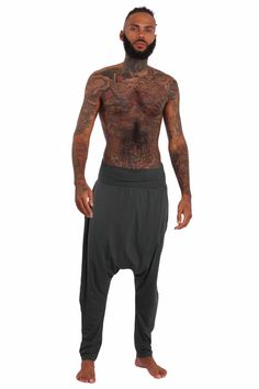 The Harlem Mens Harem Pants have a stretchy quality that allows for total freedom of movement for everything from sleeping to yoga class. Our eco friendly, Tencel fabric is breathable, moisture wicking and super soft. Somehow it magically gets even softer with each wash too! Thanks to their easy, pull on styling you will reach for them time and time again. FEATURES: Wide, folded over forgiving waistband for a comfortable and second skin feel Drop crotch style Tapered leg Wear them long or pulled Mens Harem Pants, Grey Lounge, Drop Crotch Pants, Tencel Fabric, Streetwear Shop, Pants For Men, Steel Grey, Sustainable Fabrics, Yoga Class