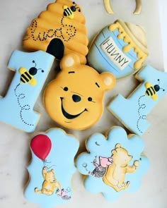 some cookies that are shaped like winnie the pooh