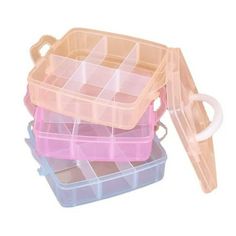 three plastic containers with dividers on top of each other, one is pink and the other is blue