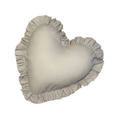 a heart shaped pillow with ruffled edges