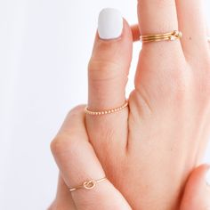 Dainty and delicate, the Love Me Knot Ring is one of the sweetest additions to our stacking kellection. Made to remember the ties to our loved ones, this beauty is the perfect gift for the special someone in your life or to permanently have your nearest and dearest close at hand. Dainty Adjustable Stackable Rings For Everyday, Dainty Adjustable Rings For Everyday Wear, Adjustable Dainty Stackable Rings For Everyday, Dainty Stackable Rings As Gift, Dainty Stackable Rings Gift, Dainty Midi Rings For Gifts, Minimalist Stackable Rings For Gifts, Minimalist Stackable Rings For Gift, Elegant Midi Rings With Simple Design For Gift