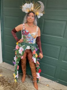 a woman dressed in costume standing next to a garage door with her hands on her hips