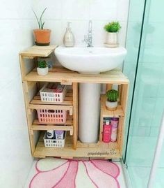 a bathroom with a sink and shelves in it