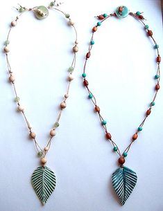 two necklaces with leaves and beads on them