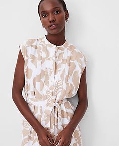 Step into summer with elegance in the Ann Taylor Petite Tropical Belted Shirtdress. Perfect for warm weather outings, this dress features a charming pineapple print that captures the essence of tropical bliss.

- Size: Petite 12
- Color: Toasted Oat
- Material: 100% Polyester
- Gender: Female
- Features: Mandarin collar, cap sleeves, button front, front and back pleats, self-tie waist, back yoke, lined
- Length: 24 inches from natural waist
- Care Instructions: Machine washable

This delightful Female Features, Ann Taylor Petite, Pineapple Print, Petite Dresses, Mandarin Collar, Summer Wardrobe, Warm Weather, Effortless Style, Ann Taylor