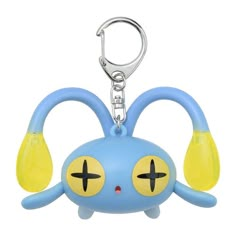 a blue and yellow keychain shaped like an animal with two ears on it's head