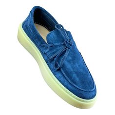 Elevate your style with these Bata moccasins for men. Crafted with genuine leather, these slipper shoes feature a solid blue color and a suede lining. The shoes come in size 42, which is equivalent to US size 8.5-9 and UK size 8. These moccasins are perfect for casual occasions, and the camoscio model adds a touch of sophistication to your outfit. The shoes are made in Italy, ensuring high-quality materials and attention to detail.The outsole and upper material are both made of suede, while the Blue Slip-on Moccasins, Blue Suede Slip-ons With Contrast Sole, Blue Slip-on Loafers With Rubber Sole, Blue Slip-on Moccasins With Rubber Sole, Blue Loafers With Stitched Sole And Plain Toe, Blue Moccasins With Leather Sole And Moc Toe, Blue Loafers With Textured Sole And Plain Toe, Blue Slip-on Boat Shoes With Rubber Sole, Blue Loafers With Textured Sole