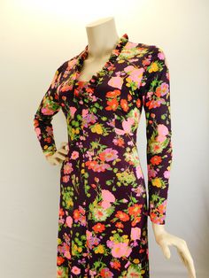 "Vintage 70s long sleeve floral maxi dress, deep wine with pink and orange floral. Sweet 70s maxi dress with long sleeves with ruffled V neck and hem. Full metal zipper in the back. It has a fitted bodice and drapes beautifully. I believe it's a polyester blend and does have some stretch to it. Measured flat Shoulders 15\" Sleeve 22\" Underarms 16\" 32\" bust waist 14\" 28\" waist Hips 18\" 36\" hip Length 54\"" Retro Spring Dresses With Stretch, Long Sleeve Floral Maxi Dress, Maxi Dress With Long Sleeves, 70s Maxi Dress, Dress With Long Sleeves, Mod Dress, Pink Maxi Dress, Full Metal, Metal Zipper