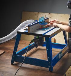 a person using a router on a workbench to build a table sawhorse