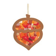 an ornament made out of colored paper with a heart cut out of it