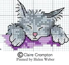 a cross stitch pattern with a cat laying down