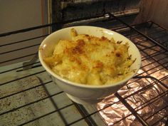 a bowl of food sitting on top of an oven rack