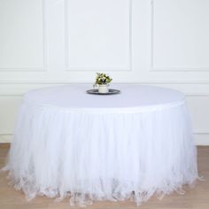 [About] Quantity: 1 Table Skirt Material: Tulle Lining Material: Cotton Color: White Size: 17ft wide x 29" tall No. of Tulle Layers: 4 Top Satin Width: 2" All table skirts come with 1" velcro on top for attachment to clips. (Clips are sold separately) Tablecloth and decorations are not included. [Information] Additional Information: Material: Tulle Measurements: 17ft wide x 29" tall How to Care: Hand wash only. Hang dry, don't use dryer. Total 4 layers once skirt is fully fluffed For 1 piece tab Pleated Table Skirt, Tutu Table Skirt, Tutu En Tulle, Tutu Table, Tulle Table Skirt, Tulle Table, Table Skirts, Top Satin, Skirt Elegant