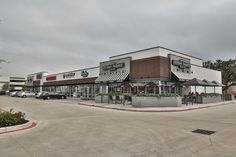 an empty parking lot in front of a restaurant