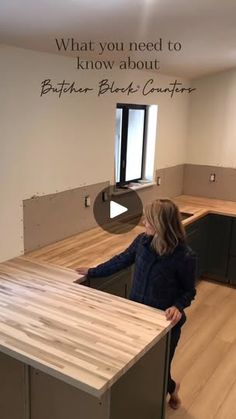 a woman standing in an empty kitchen with the words what you need to know about butcher block counters