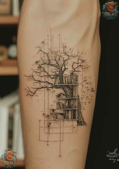 a man's arm with a tree and bookshelf tattoo on the side