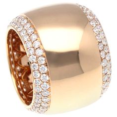 a gold ring with diamonds on it