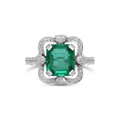 Metal: 14K White Gold Gemstones: 3.10 Cts. Emerald 0.35 Cts. Diamond Luxury Emerald Ring With Halo Diamond Design, Luxury Heart Cut Emerald Ring For Formal Occasions, Gia Certified Elegant Emerald Gemstones, Elegant Gia Certified Emerald Gemstones, Timeless Emerald Ring With Accent Stones For Formal Occasions, Timeless Formal Emerald Ring With Accent Stones, Emerald Cut Platinum Gemstones In White Gold, Elegant Cushion Cut Gemstone With Center Stone, Classic Platinum Gemstones With Halo Setting