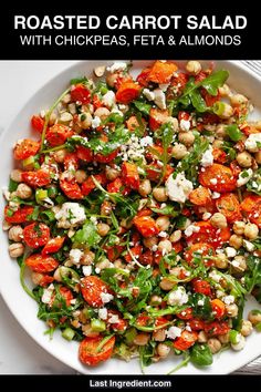 roasted carrot salad with chickpeas, feta and almonds in a white bowl