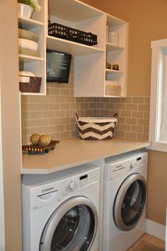 a washer and dryer in a small room